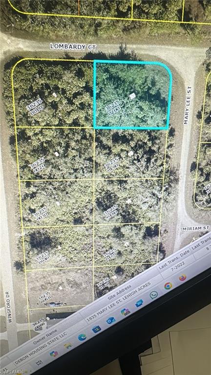 Aerial map of property and surrounding area featuring property parcel outlined