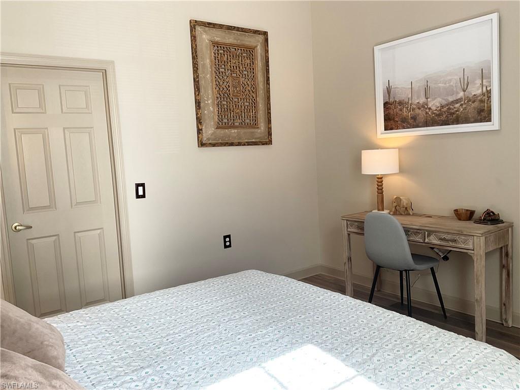 Guest Bedroom with closet, ceiling fan, desk
