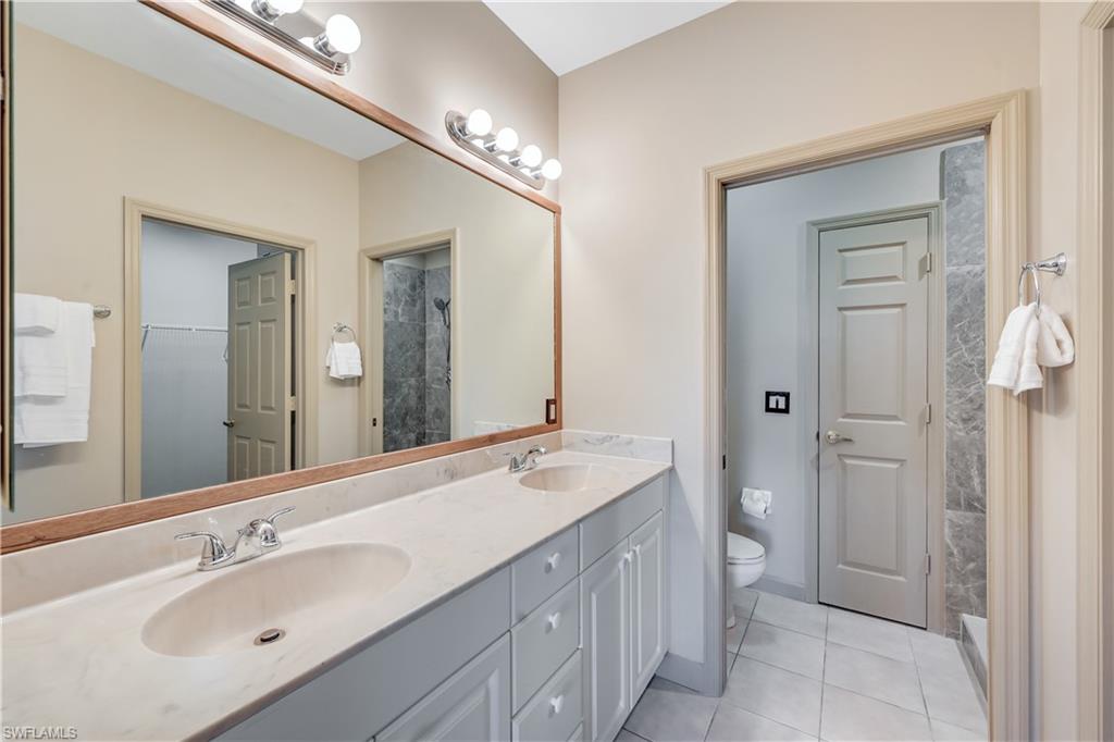 Primary Bathroom with Double Sink and Walk-In Closet and Walk-in Shower