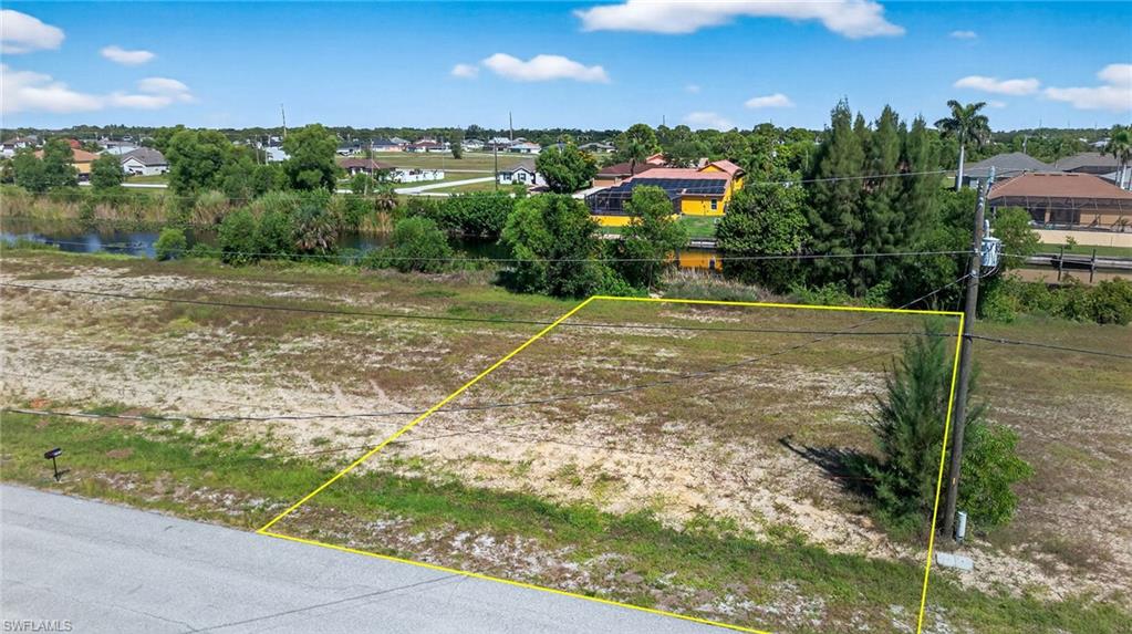 Aerial view of residential area with property parcel outlined