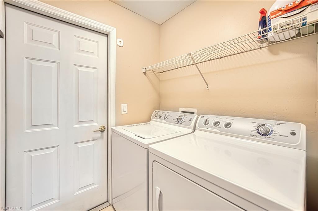 Laundry room featuring washing machine and clothes dryer
