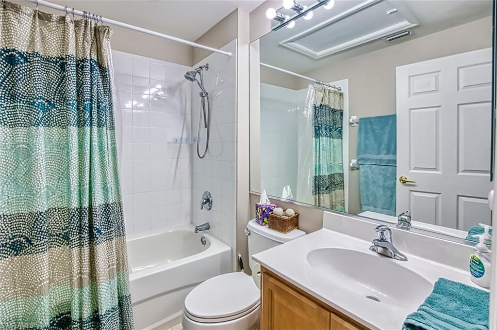 Bathroom featuring shower / bath combo and vanity