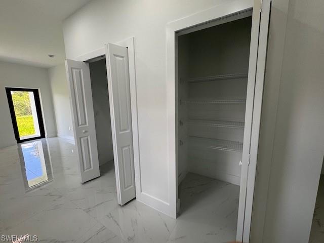 View of closet pantry and close for washer-dryer.