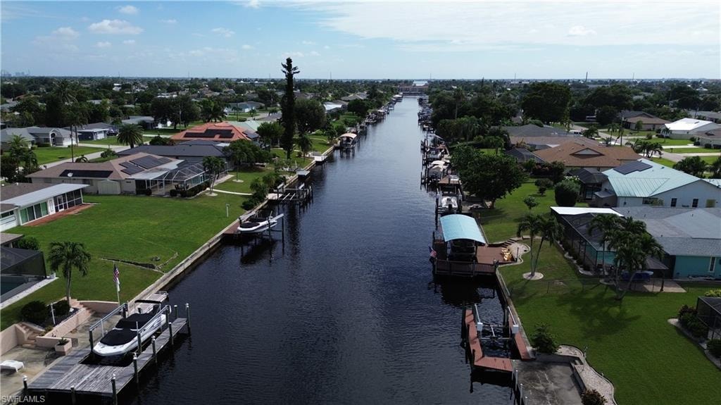 Aerial perspective of suburban area featuring a large body of water
