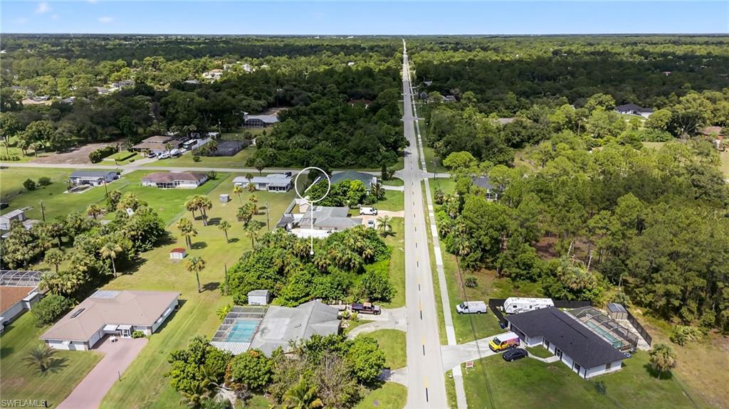 View of property location with nearby suburban area