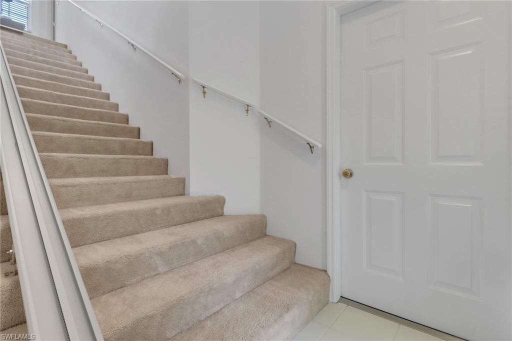 Stairway leading from foyer to living space
