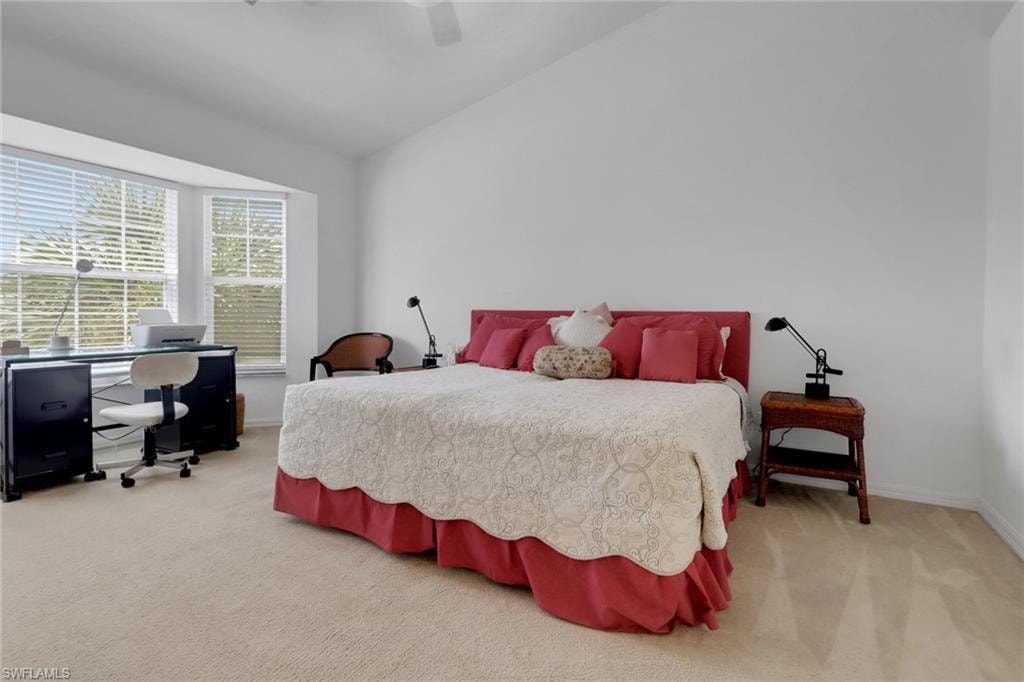 Primary bedroom with vaulted ceiling and two closets (one walk in)