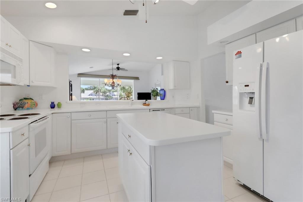 Very LIGHT and BRIGHT kitchen...looking towards living area and lake view