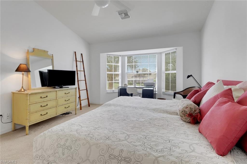 Primary bedroom with front and center views of lake/fountain