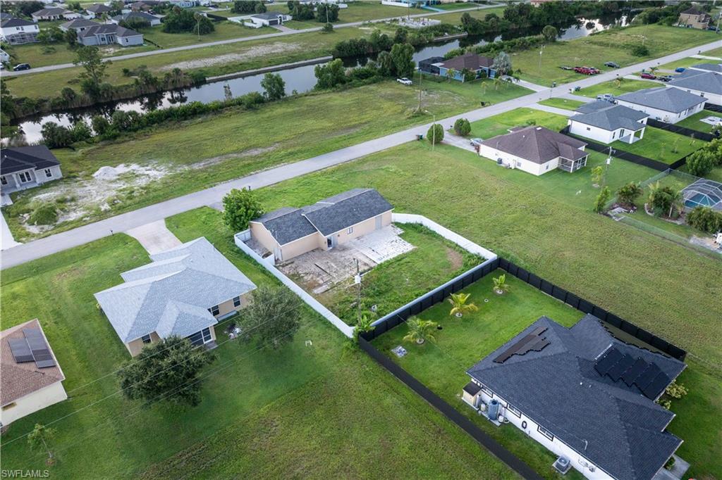 Aerial view of residential area with a large body of water
