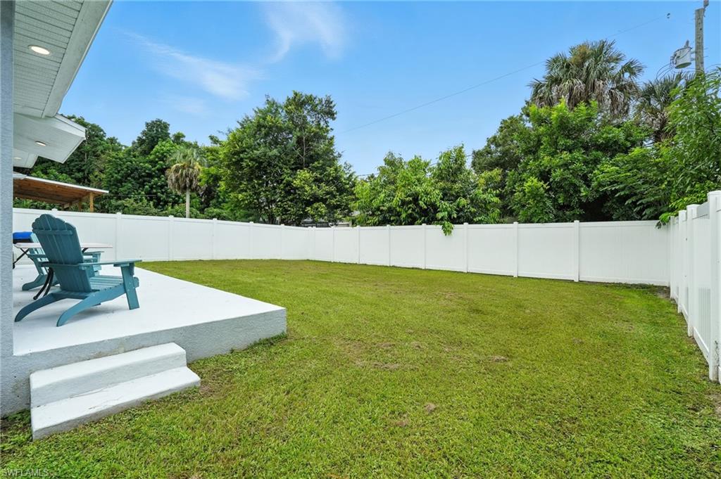 Fenced backyard with a patio area