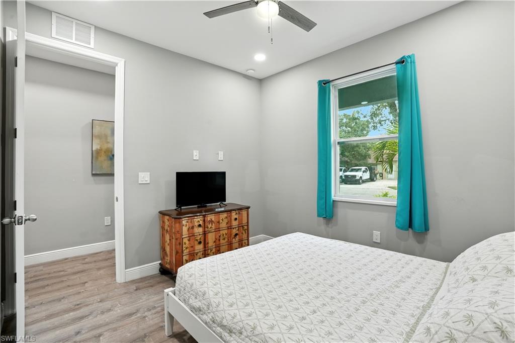 Bedroom with light wood finished floors, recessed lighting, and ceiling fan