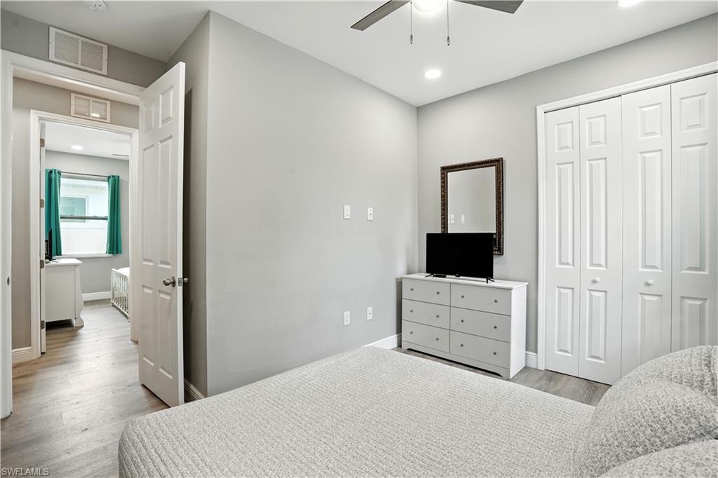 Bedroom featuring light wood-type flooring, recessed lighting, a closet, and ceiling fan
