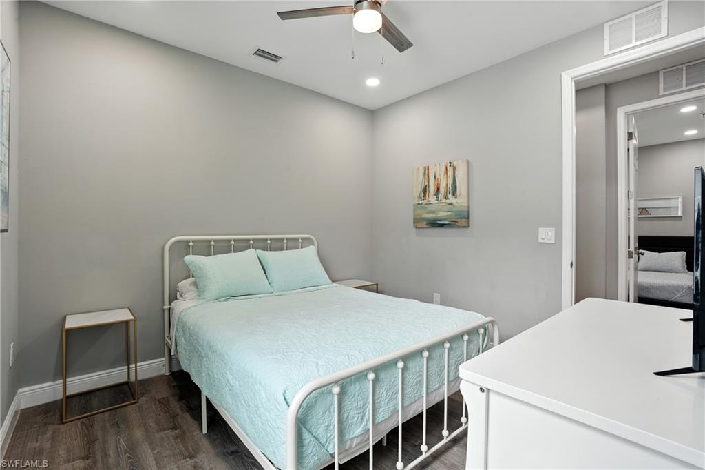 Bedroom with recessed lighting, dark wood finished floors, and a ceiling fan