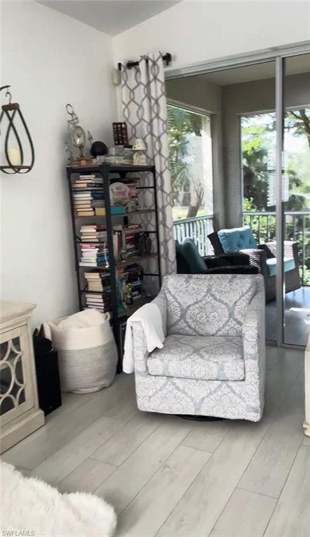 Living area with light wood-type flooring