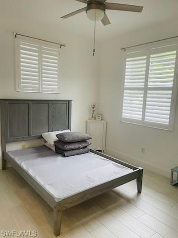 Bedroom featuring light wood finished floors and a ceiling fan