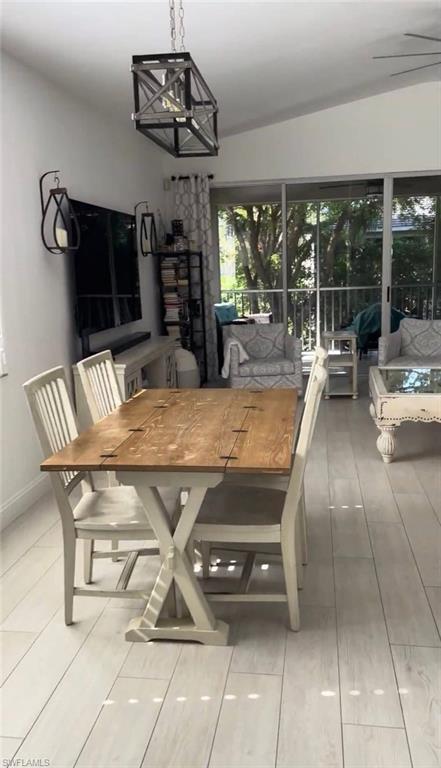Dining room with baseboards and a chandelier