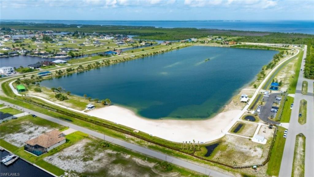 Aerial perspective of suburban area with a nearby body of water