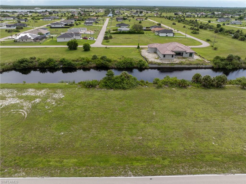 Aerial perspective of suburban area with a large body of water