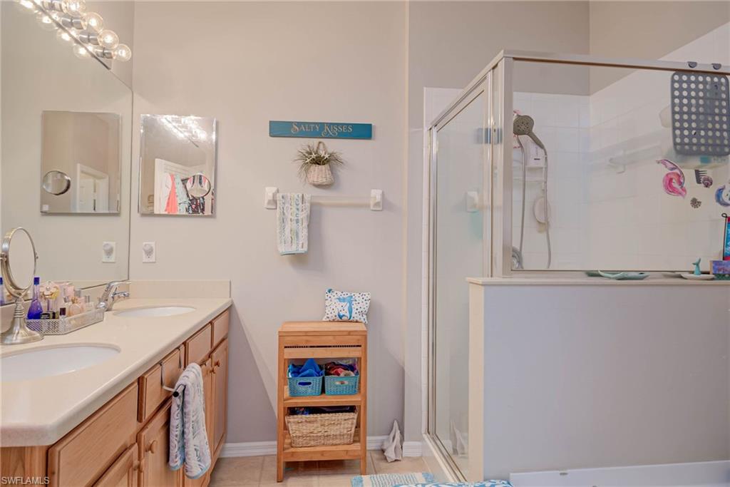 Primary bath offers dual sinks, walk in shower and soaking tub.