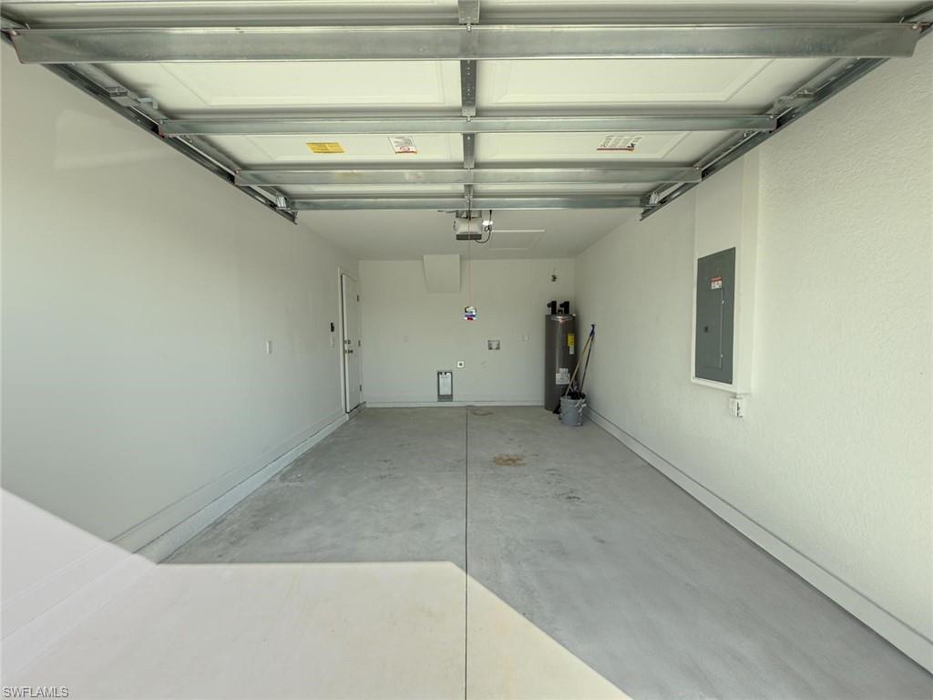 Garage with electric panel and electric water heater