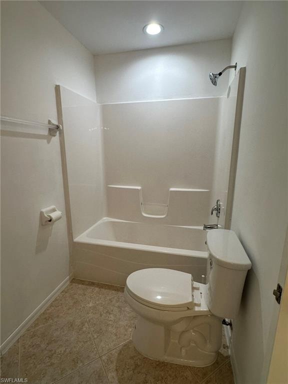 Full bathroom featuring washtub / shower combination and light tile patterned floors