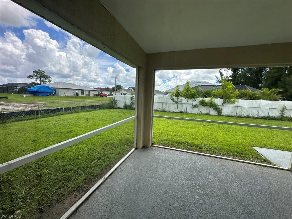 Unfurnished sunroom with a residential view