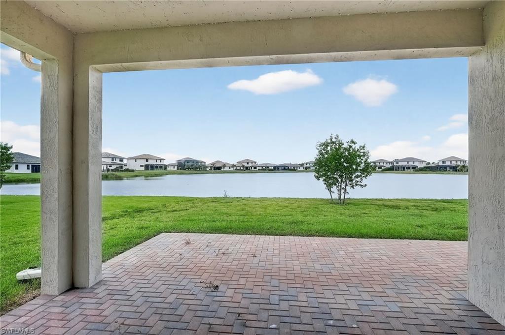 View of patio / terrace featuring a residential view and a water view