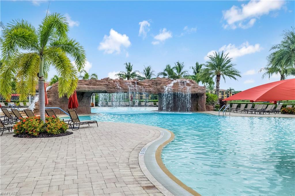 Community pool with a patio and a pergola