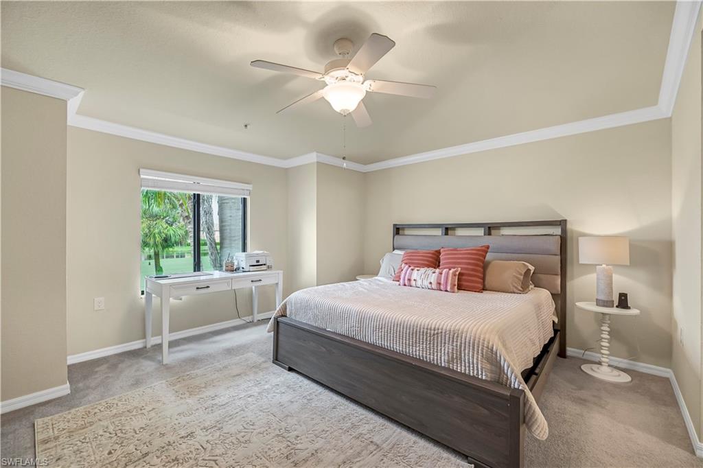 Master Bedroom with carpet, crown molding, and ceiling fan