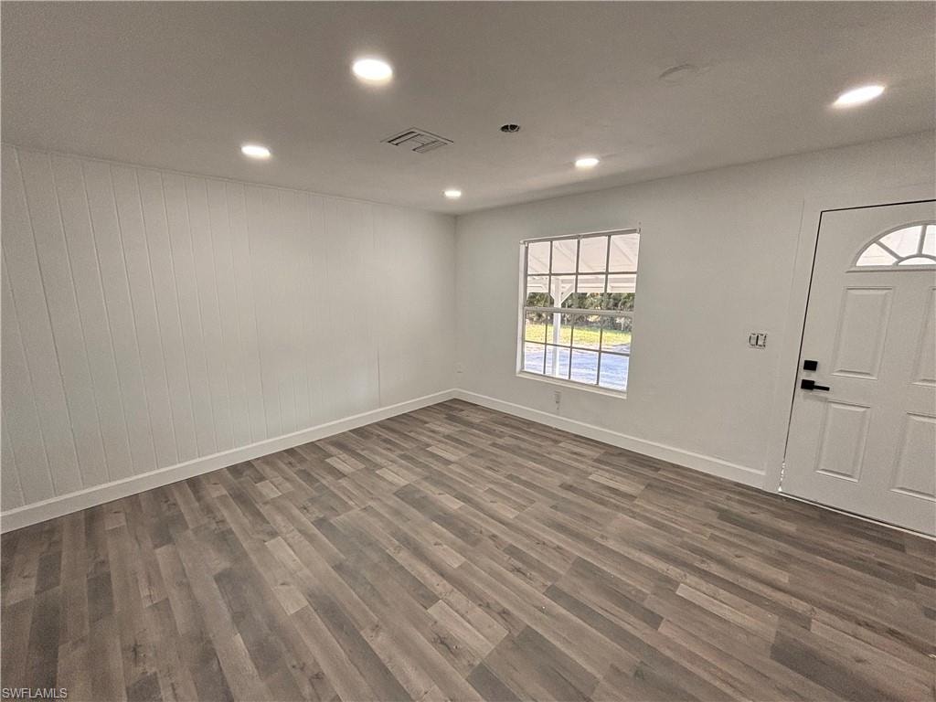 Entryway featuring recessed lighting and dark wood-style flooring