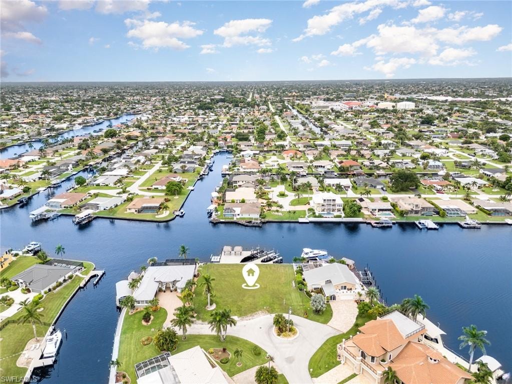 Aerial perspective of suburban area with a large body of water