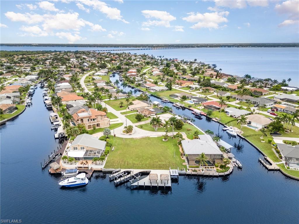 Aerial perspective of suburban area with a nearby body of water
