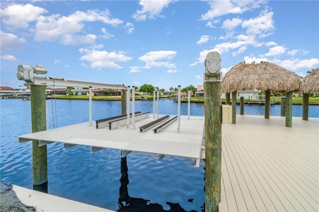 Dock with a water view and boat lift