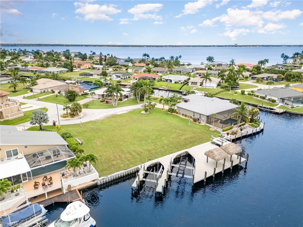 Aerial perspective of suburban area with a large body of water