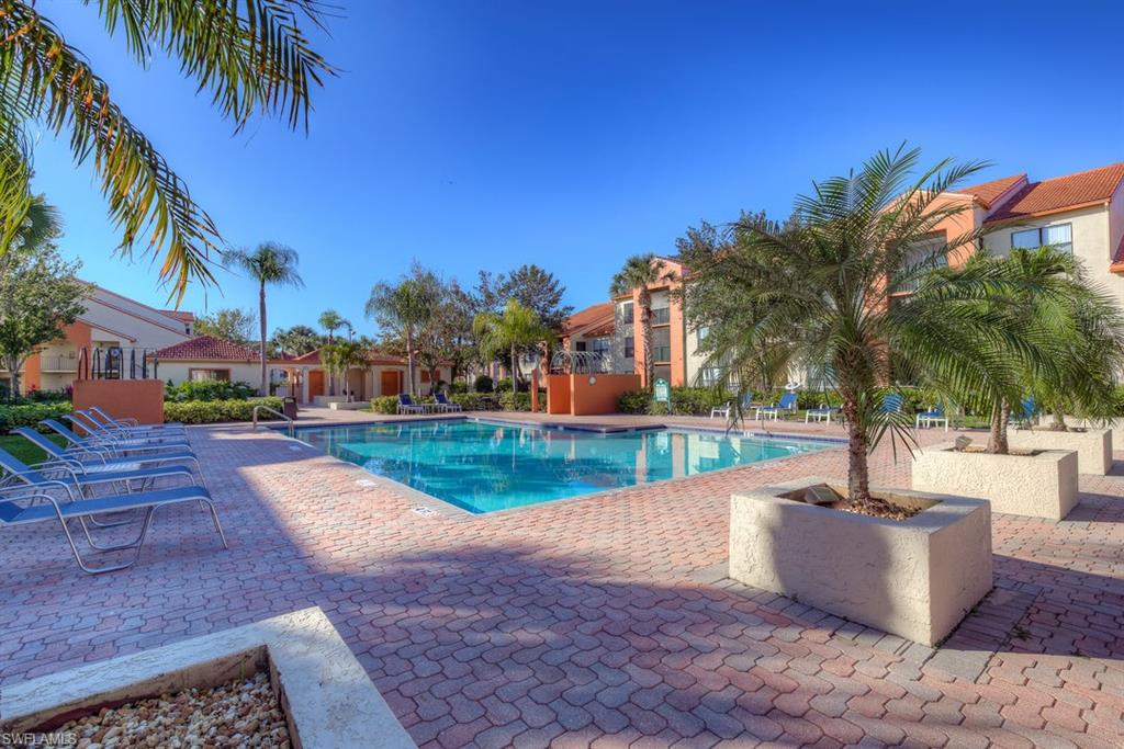 Community pool with a patio