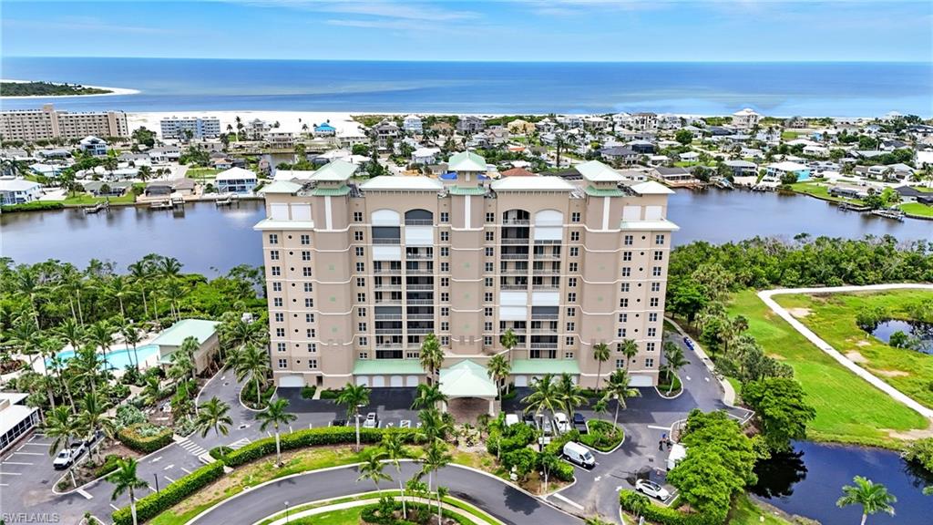 Bird's eye view of apartment complex and a nearby body of water - Virtually Edited Image