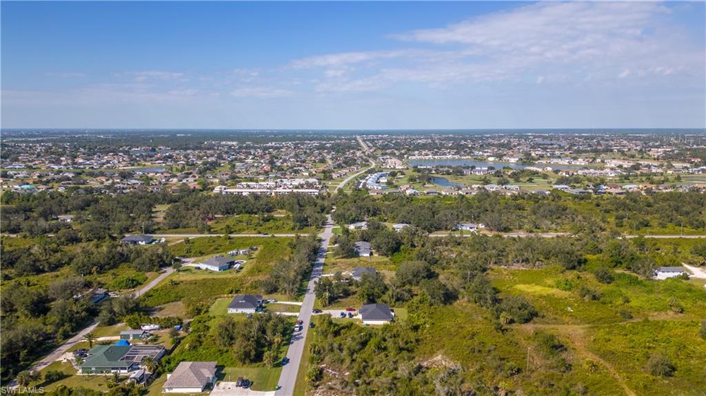 View of property location with nearby suburban area