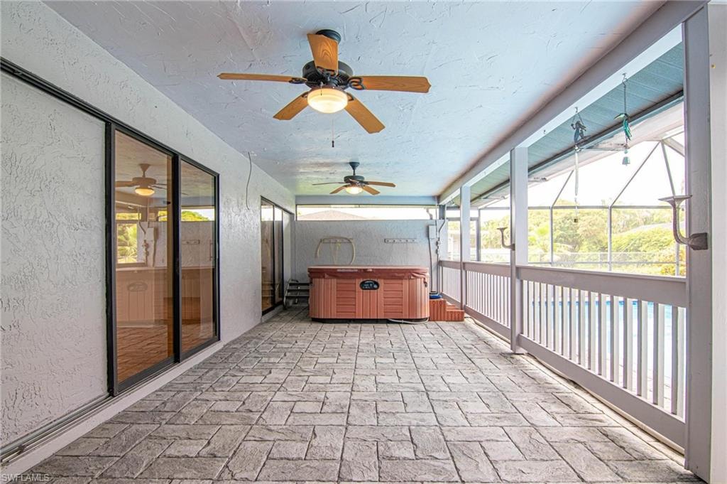 Brick pavered covered lanai area features your private hot tub!