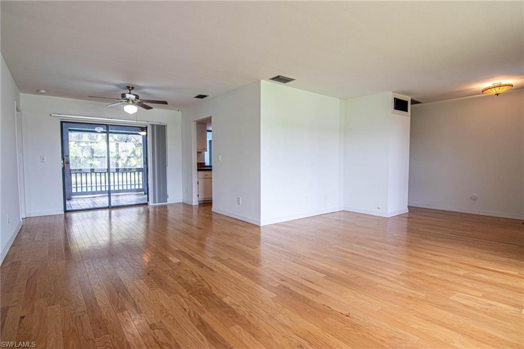 View looking to formal dining area with pocket slider opening to pool lanai