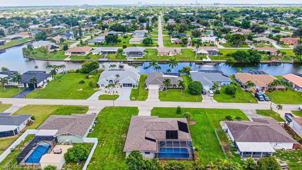 Aerial view looking East of houses across the street on fresh water canal!!