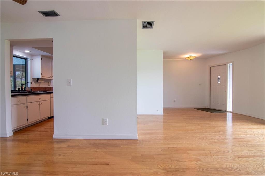 Front entry opens to an open & spacious living area.