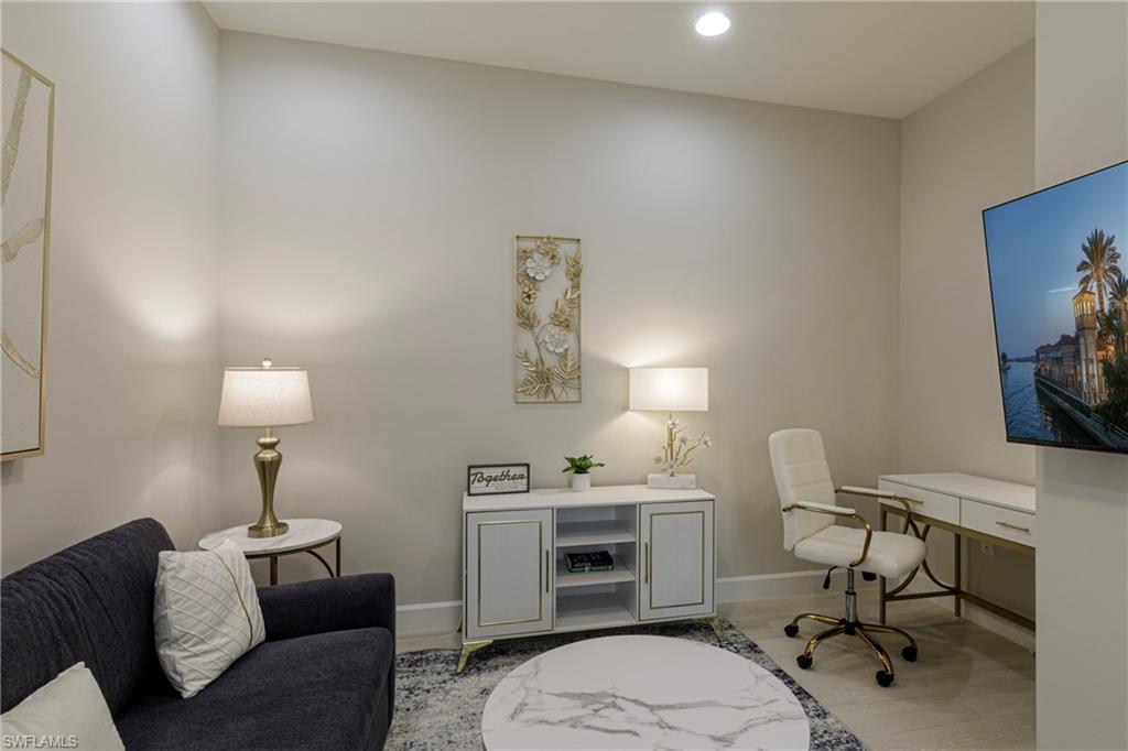 Office space with baseboards and recessed lighting