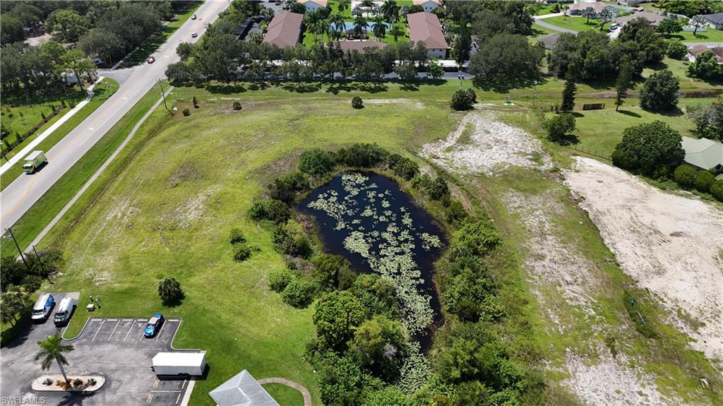Aerial view of property's location featuring a large body of water