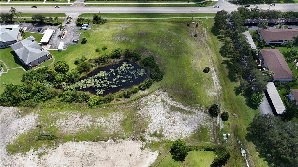 Aerial overview of property's location with a large body of water