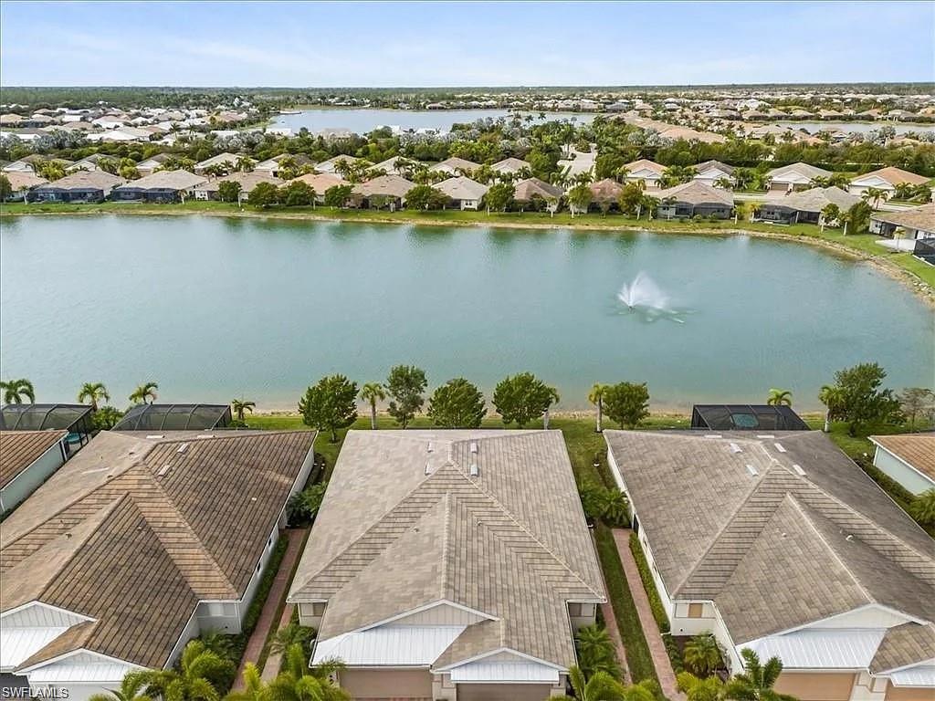 Aerial perspective of suburban area with a nearby body of water
