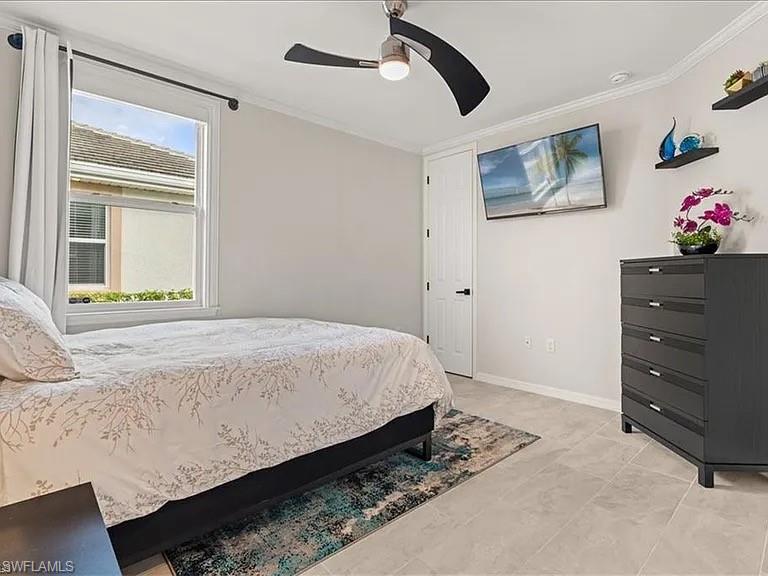 Bedroom featuring crown molding and ceiling fan
