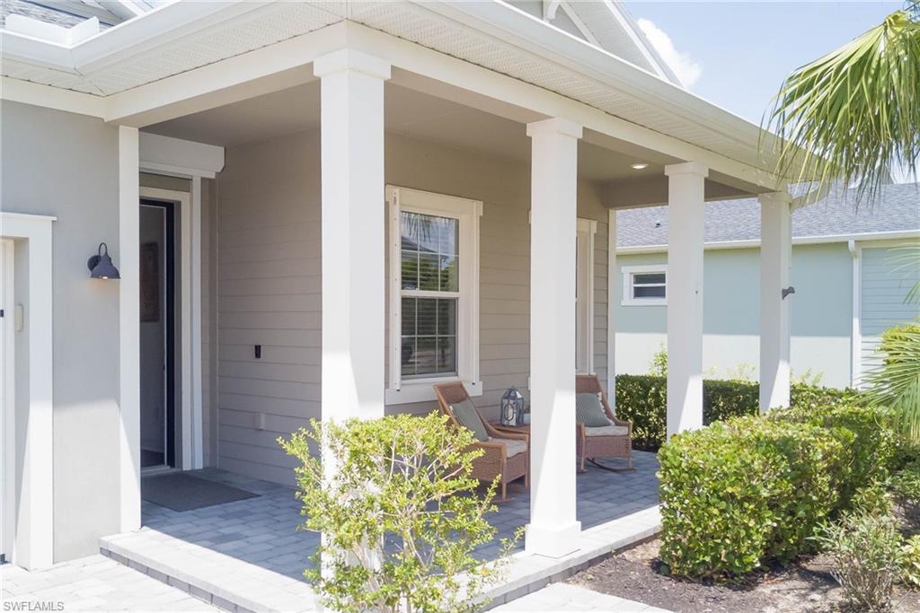 Entrance to property featuring covered porch