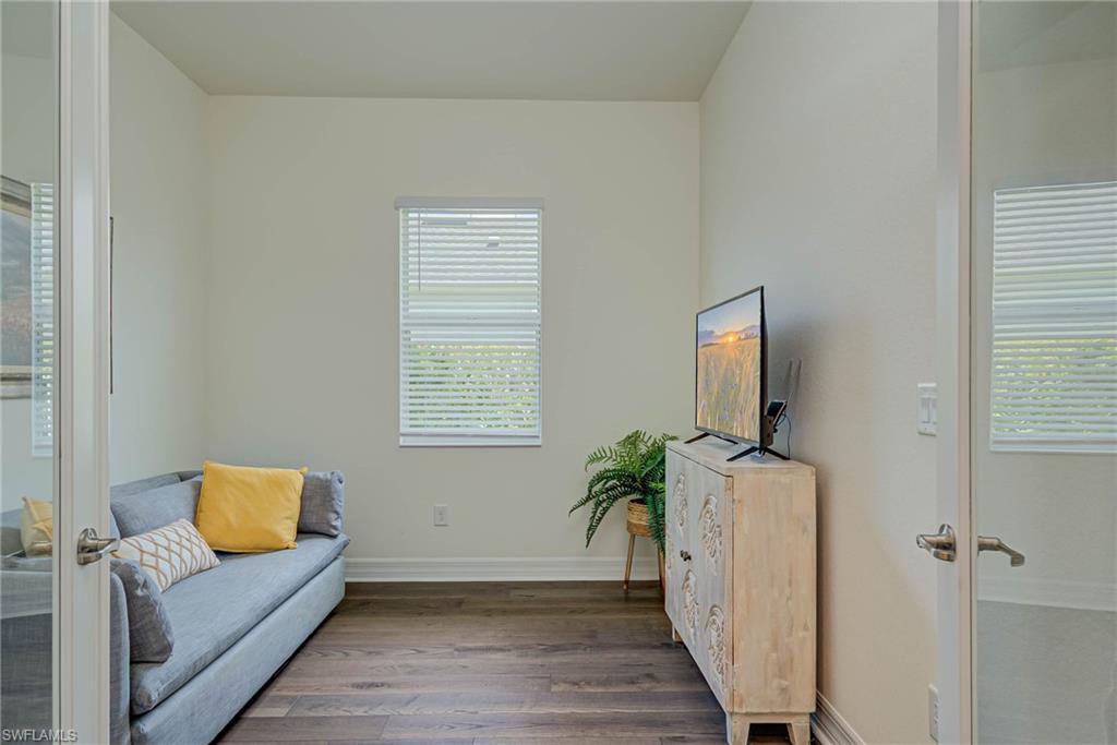 Living area with wood finished floors and french doors