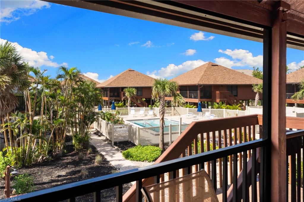 Balcony with view of pool area